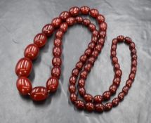 A graduated red bead necklace thought to be cherry amber, the oval beads measuring between 3.5cm