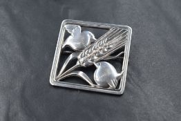 A Georg Jensen silver brooch, no: 250, the square frame having a wheat sheaf diagonally with a