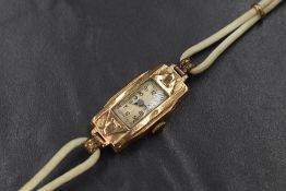 A 9ct gold cased Art Deco wristwatch, the rectangular dial having Arabic numerals, marked 375,