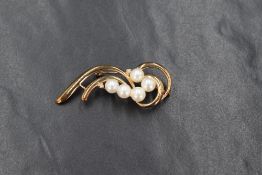 A 9ct gold pearl and diamond spray motif brooch, the five cultured pearls with two round cut diamond