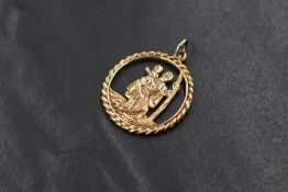 A 9ct gold open cut St Christopher pendant, marked 375, approximately 20mm & 2.2g