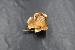 A gilt metal Grosse (Christian Dior) flower brooch, stamped Grosse, 1965, Germany en verso