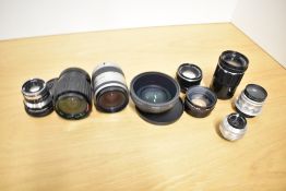 Nine Lenses. A Serie 1:3,5-4,5 28-70mm, a Pentax 1:3,5-5,6 28-80mm, a Russian 1:4 135mm, a Carl