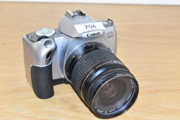 A Canon EOS 300V camera with Canon Zoom EF1:3,5-5,6 28-80mm