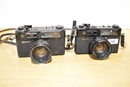 Two Yashica Electra 35 cameras with Color-Yashinon 1:1,7 45mm lenses. One is spares and repairs