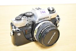 An Olympus OM10 camera with OM-System Zuiko Auto-S 1:1,8 50mm lens 20-30