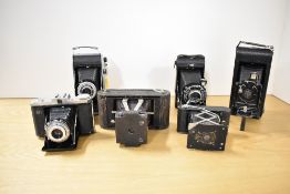Six folding cameras. A Kodak No1 Folding Pocket camera Model B, a Kodak Junior I -kodette III, a