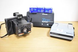 A Polaroid Image System E and a Polaroid Instant 10 camera with a Polaroid 35mm Power Processor