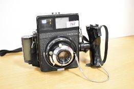 A Mamiya Super 23 camera with 1:3,5 90mm lens having Mamiya 6X9 roll addaption