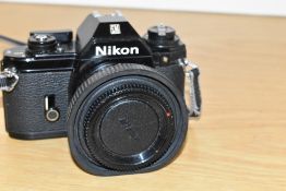 A Nikon EM SLR camera with Series E 1:1,8 50mm lens