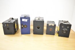 Five Box cameras. A Kodak Hawkeye No Model B, a Kodak 620 Junior O, a Houghton Ensign, an Ensign E29