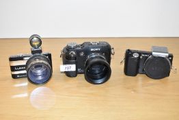 A Sony Smart Zoom VX digital Camera with a Sony HD AVCHO digital camera and a Lumix DMC FS7
