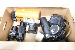 A Praktica LTL3 camera with Pentacon auto 1:1,8 50mm lens, Chinon 1:5,6 300mm lens, Chinon 1:2,8