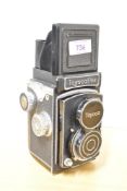 A Toyocaflex reflex camera in leather case