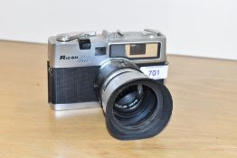 A Ricoh Mate 35mm camera with Ricoh 1:2,8 4.5cm lens