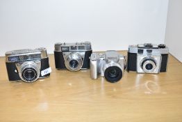 Four Kodak cameras. A Coulorsnap, a Retina IIF, a Retinette 1B, and a Kodak Easyshare Z612 digital