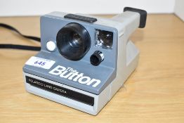 A Polaroid 'the Button' Land Camera