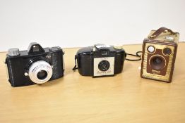 Three cameras. An Agfa Click 1, a Kodak Brownie 127, and a Kodak Brownie Six-20 Model F box camera