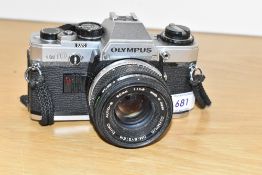 An Olympus OM10 camera with OM System Zuiko Auto S 1:1,8 50mm lens