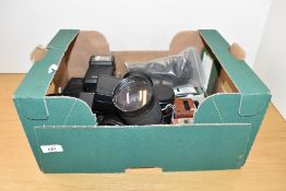 A box of various meters, flash shoes, and lenses. A MV Metrovic, a Glossan Sixan, Zeiss Ikon