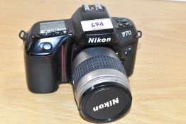 A Nikon F70 with Nikkor 1:3,3-5,6 28-80mm lens