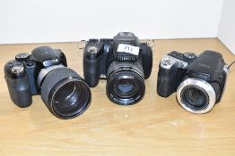 Three Fujifilm digital cameras. A Finepix S8100, a Finepix HS10 and a Finepix S
