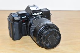 A Minolta 7000 camera with Sigma Zoom K 1:4-5,6 70-210mm lens