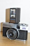 An Olympus Trip 35 camera with Olympus PS200 flash