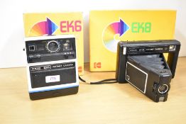Two Kodak Instant cameras. An EK8 and an EK6