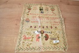 A late 19th / early 20th century needlework sampler decorated with floral border and reading '