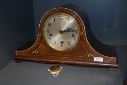 An early 20th century 'Nelson' mantel clock having Westminister chimes and boxwood inlay, W48cm