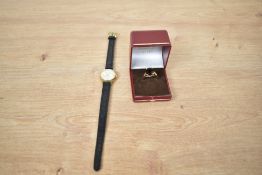 A lady's gold plated Montine wrist watch having baton numeral dial to champagne face in circular