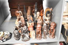 A large group of carved African tribal figures, largest h37cm