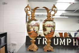 A pair of large early 20th century style metal and pottery Ewers, hand painted depicting fisherman