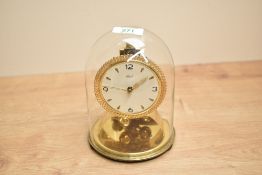 A mid - century 'Kundo' 400 day brass mantel clock with glass dome, h16
