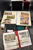 A box containing various postcards and stamps, subjects include city's of Boston, New York and