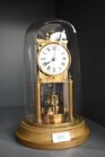 An early 20th century 400 day clock with cylindrical glass dome, h27cm Condition report: Require's