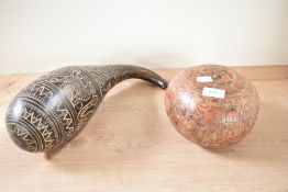 A small hand-engraved Peruvian Calabash storyteller, having an hexagonal lid, h12cm, sold together