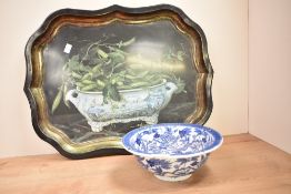 A Wedgwood blue and white bowl decorated with floral patterns, w23.5cm, sold together with a serving