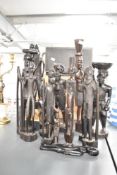 A group of hand carved wooden African tribal figures of various forms, tallest 50cm