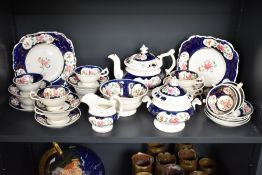 A Victorian Gaudy Welsh feather pattern tea service, decorated in cobalt blue and floral patterns