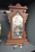 A late 19th century Ansonia (U.S.A) 'Gingerbread' clock having single gong chime and carved