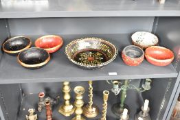 A paper mache fruit bowl, hand painted with floral patterns on a black ground, w25cm, sold