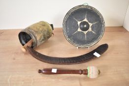 A Chinese gong, 21cm, sold together with a bell and leather boomerang, (3)