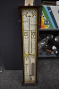 A mid-century Fitzroy barometer in mahogany case, having atmosphere and temperature gauge, model