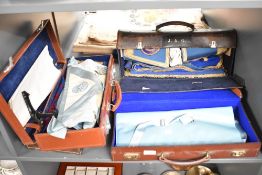 A group of four leather cases containing Masonic aprons and documents