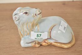 A Chinese porcelain figure of a seated goat or sheep, L13cm