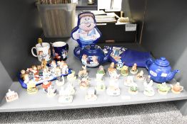 A large group of Tetley tea advertising mascots, to include tea / coffee pots, biscuit tin ect, sold