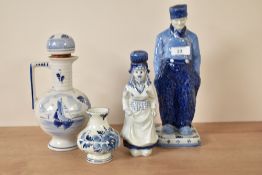 A rare Royal Delft blue and white Farmer figure, h28.5cm, sold together with a Delft Dutch girl, a