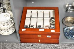 A wooden watch display and storage box with key, having fifteen section with below draw,